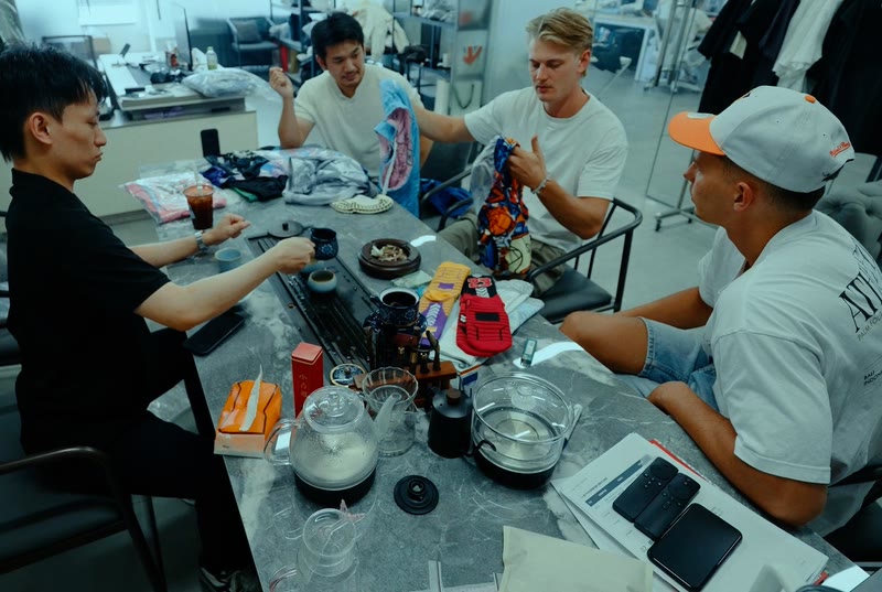 The Silk Road team going through samples and terms with a supplier over tea